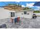 Relaxing patio with dining table, umbrella, and grill at 4104 W Marietta St, Tampa, FL 33616