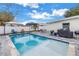 Private backyard with sparkling pool, patio furniture, and grill at 4104 W Marietta St, Tampa, FL 33616