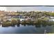 Aerial view showcasing waterfront homes and lush greenery at 415 Country Club Dr, Oldsmar, FL 34677