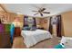 Spacious bedroom with a king-size bed and ceiling fan at 5147 Perennial Dr, Holiday, FL 34690