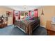 Main bedroom with a king-size bed and blue carpet at 5147 Perennial Dr, Holiday, FL 34690