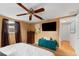 Bright bedroom with large TV and ample closet space at 5147 Perennial Dr, Holiday, FL 34690