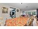 Dining room with table, chairs, and view into the living room at 5147 Perennial Dr, Holiday, FL 34690