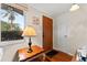 Bright entryway with wood floors and a wooden side table at 5147 Perennial Dr, Holiday, FL 34690
