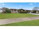 House exterior showcasing a neat lawn and a driveway at 5147 Perennial Dr, Holiday, FL 34690