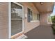 Front entrance with a glass storm door and tiled entryway at 5147 Perennial Dr, Holiday, FL 34690