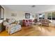 Living room with hardwood floors and floral patterned furniture at 5147 Perennial Dr, Holiday, FL 34690