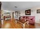 Spacious living room featuring hardwood floors and comfortable seating at 5147 Perennial Dr, Holiday, FL 34690