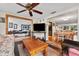 Living room with wood coffee table and view to dining area at 5147 Perennial Dr, Holiday, FL 34690