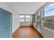 Bright sunroom with ample natural light and storage at 5147 Perennial Dr, Holiday, FL 34690