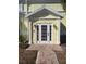 Inviting building entrance with a white door and brick pathway at 5215 Coquina Key Se Dr # A, St Petersburg, FL 33705