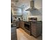 Modern kitchen with stainless steel appliances and granite countertops at 5215 Coquina Key Se Dr # A, St Petersburg, FL 33705