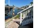 Steps leading down to the water, with a boat visible at 5215 Coquina Key Se Dr # A, St Petersburg, FL 33705