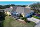 Aerial view of house showing roof, garage, and landscaping at 5320 Golden Isles Dr, Apollo Beach, FL 33572
