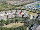 Aerial view showcasing a house's location within a neighborhood at 5320 Golden Isles Dr, Apollo Beach, FL 33572