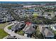 Aerial view of a home in a residential community with a lake nearby at 5320 Golden Isles Dr, Apollo Beach, FL 33572
