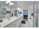 Spacious bathroom with double vanity and a large mirror at 5320 Golden Isles Dr, Apollo Beach, FL 33572