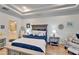 Spacious bedroom with ensuite bathroom access and wood flooring at 5320 Golden Isles Dr, Apollo Beach, FL 33572