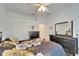 Bedroom with large closet and floral bedding at 5320 Golden Isles Dr, Apollo Beach, FL 33572