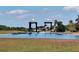 Waterway entrance with decorative bridges at 5320 Golden Isles Dr, Apollo Beach, FL 33572