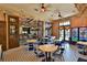 Community room with tables, chairs, and a vintage feel at 5320 Golden Isles Dr, Apollo Beach, FL 33572