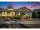 Inviting exterior of a charming villa at dusk at 5320 Golden Isles Dr, Apollo Beach, FL 33572