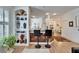 Kitchen with breakfast bar and view into living room at 5320 Golden Isles Dr, Apollo Beach, FL 33572