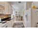 Well-equipped kitchen with white appliances and ample counter space at 5320 Golden Isles Dr, Apollo Beach, FL 33572