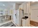 Kitchen with white cabinets, breakfast nook and pantry at 5320 Golden Isles Dr, Apollo Beach, FL 33572