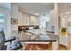 Modern kitchen with white cabinets, granite counters, and breakfast bar at 5320 Golden Isles Dr, Apollo Beach, FL 33572