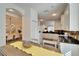 Open concept kitchen with white cabinets and granite countertops at 5320 Golden Isles Dr, Apollo Beach, FL 33572