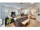 Open concept living room with fireplace and kitchen views at 5320 Golden Isles Dr, Apollo Beach, FL 33572