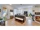 Spacious living room with comfortable seating and a fireplace at 5320 Golden Isles Dr, Apollo Beach, FL 33572