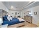 Bright main bedroom with a large bed and dresser at 5320 Golden Isles Dr, Apollo Beach, FL 33572