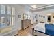Main bedroom with a dresser and window seat at 5320 Golden Isles Dr, Apollo Beach, FL 33572