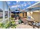 Screened patio with seating area and umbrellas, perfect for outdoor relaxation at 5320 Golden Isles Dr, Apollo Beach, FL 33572