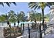 Gated pool area with a lighthouse and palm trees at 5320 Golden Isles Dr, Apollo Beach, FL 33572