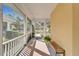 Relaxing screened porch with a bench and room for seating at 5320 Golden Isles Dr, Apollo Beach, FL 33572