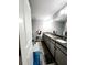 Modern bathroom with double vanity and walk-in shower at 5508 Viola Lee Way, Lutz, FL 33558