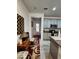 Bright foyer with a view into the kitchen and decorative rug at 5508 Viola Lee Way, Lutz, FL 33558