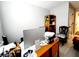 Home office with desk, chair, and built-in shelving at 5508 Viola Lee Way, Lutz, FL 33558