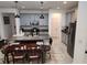Modern kitchen with gray cabinets, granite countertops, and island at 5508 Viola Lee Way, Lutz, FL 33558