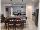 Modern kitchen with gray cabinets, granite island, and stainless steel appliances at 5508 Viola Lee Way, Lutz, FL 33558