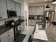 Modern kitchen with granite countertops and stainless steel appliances at 5508 Viola Lee Way, Lutz, FL 33558