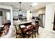 Modern kitchen with gray cabinets, granite island, and stainless steel appliances at 5508 Viola Lee Way, Lutz, FL 33558