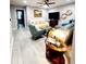 Living room with sectional sofa, accent chair, and coffee table at 5508 Viola Lee Way, Lutz, FL 33558
