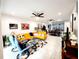 Open living room with large windows and access to kitchen at 5508 Viola Lee Way, Lutz, FL 33558