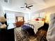 Bright main bedroom with king-size bed and ensuite bathroom at 5508 Viola Lee Way, Lutz, FL 33558