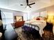 Bright main bedroom with king-size bed and ensuite bathroom at 5508 Viola Lee Way, Lutz, FL 33558