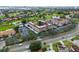 Aerial view of condo complex near golf course and water at 6100 Gulfport S Blvd # 214, Gulfport, FL 33707